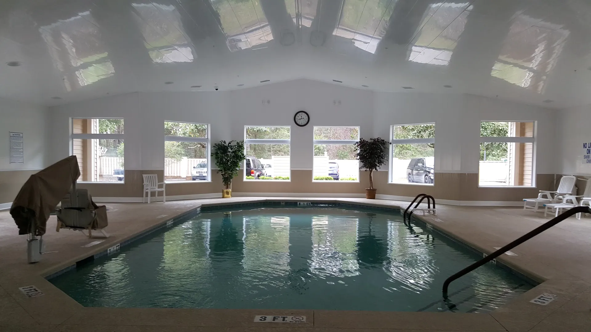 Indoor heated pool with skylights, accessible with the blue-handled key